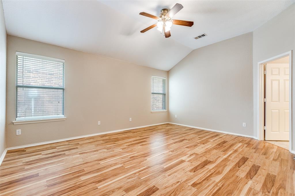 1117 Red Hawk Drive Frisco, TX 75033 - Photo 16 of 31 a view of an empty room with window and wooden floor