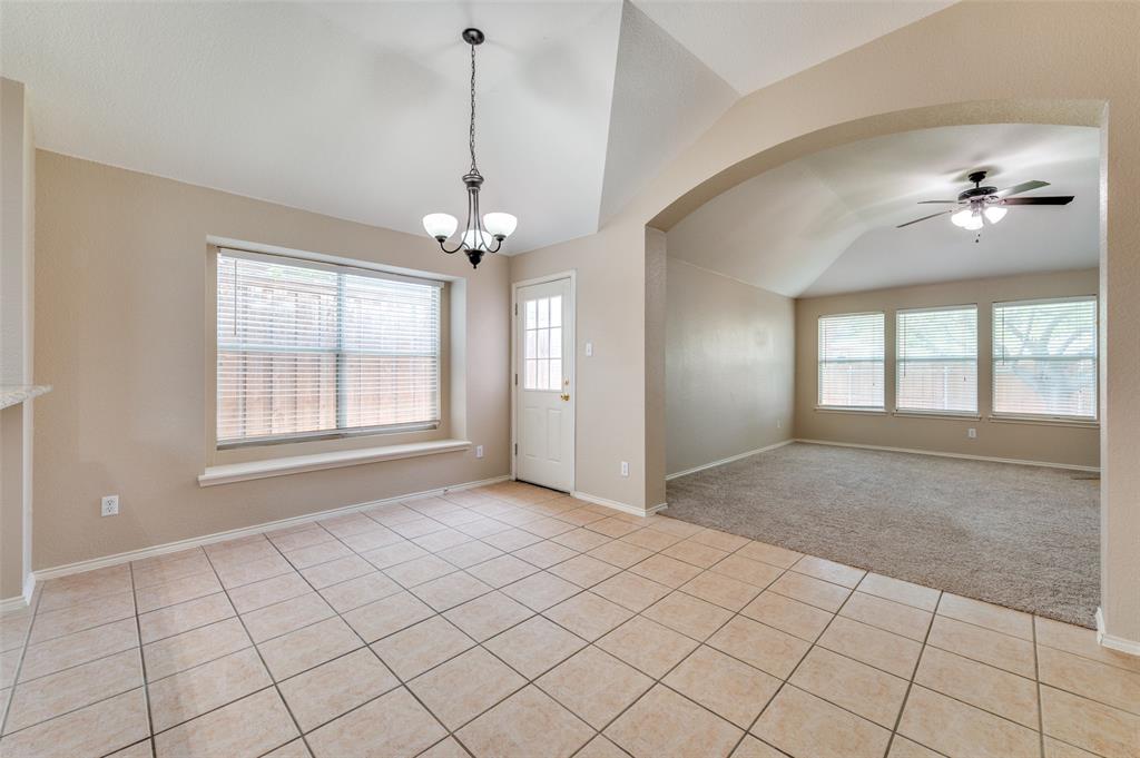 1117 Red Hawk Drive Frisco, TX 75033 - Photo 18 of 31 a view of an empty room with window and chandelier fan