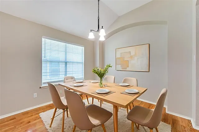 a dining room with furniture and window