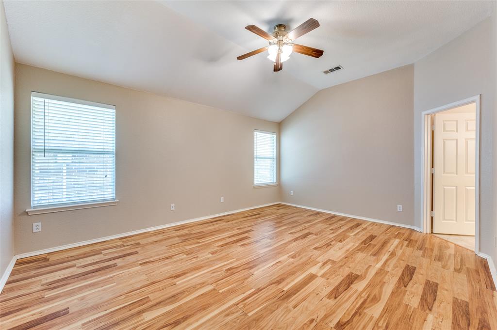 1117 Red Hawk Drive Frisco, TX 75033 - Photo 23 of 31 a view of an empty room with a window and a chandelier fan