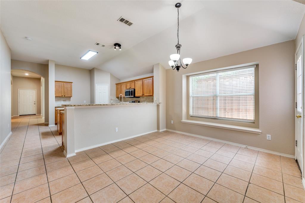 1117 Red Hawk Drive Frisco, TX 75033 - Photo 10 of 31 a view of a kitchen with microwave and refrigerator