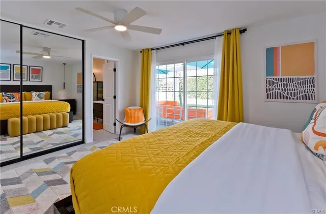 a bedroom with a bed and dresser