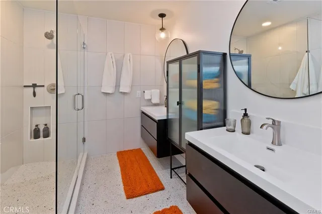 a bathroom with a tub sink and mirror