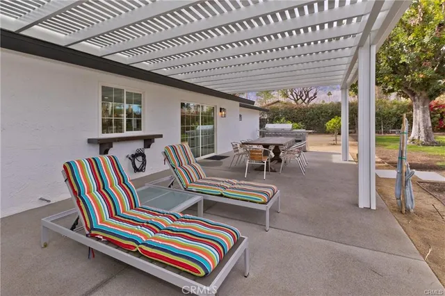 a room with furniture a flat screen tv and a large window