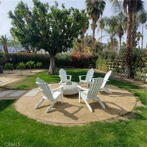 a view of a sitting area with furniture and garden