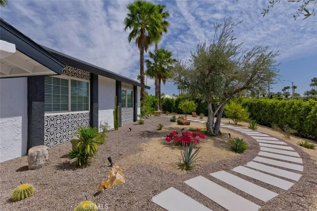a garden view with a seating space