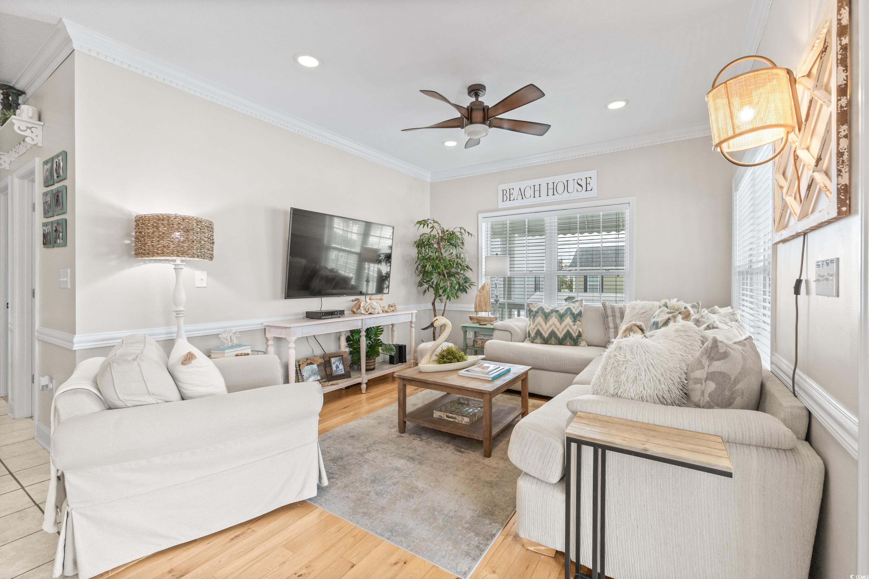 6001-1846a South Kings Highway Myrtle Beach, SC 29575 - Photo 13 of 40 Living room featuring light hardwood / wood-style floors, ceiling fan, and crown molding