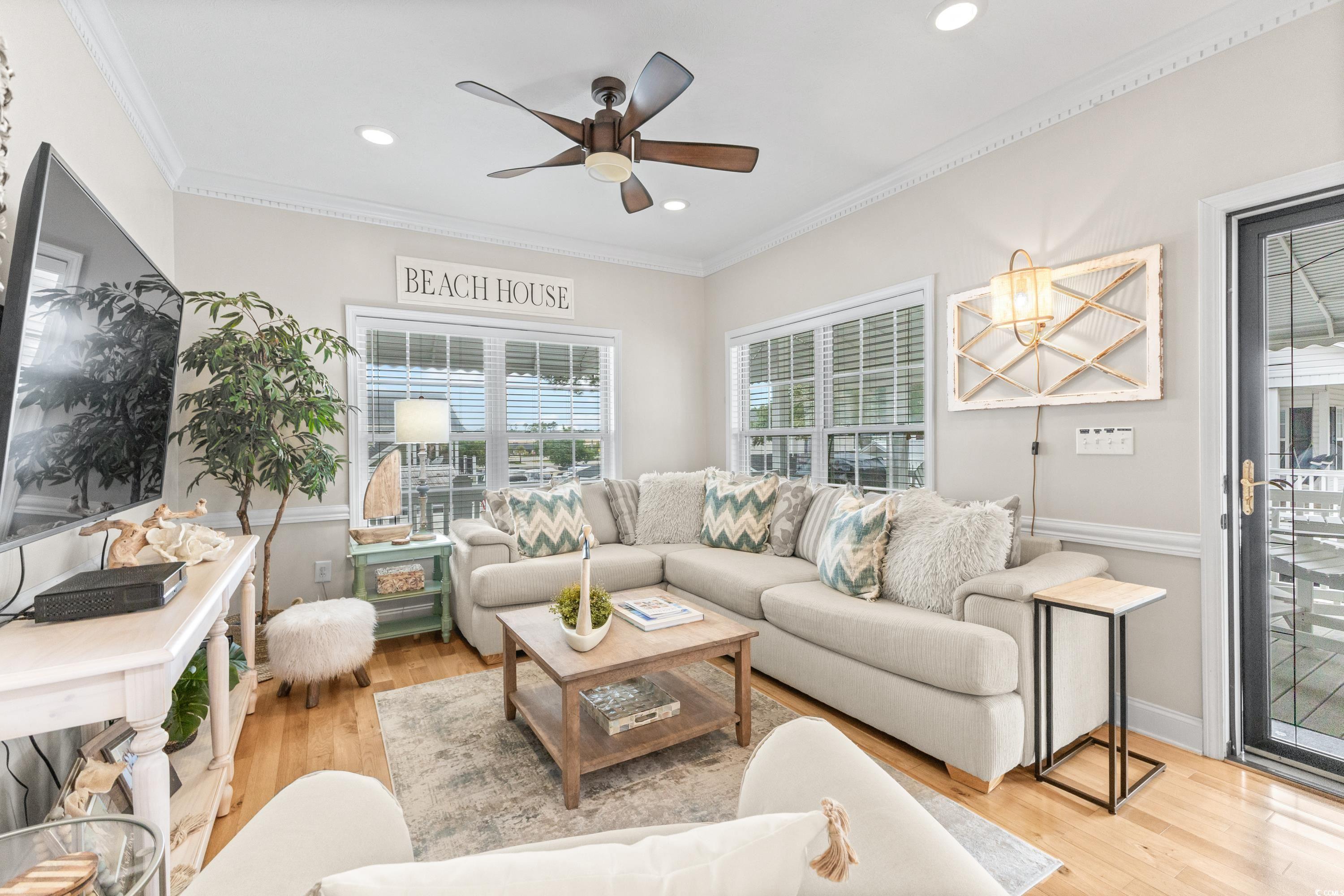 6001-1846a South Kings Highway Myrtle Beach, SC 29575 - Photo 14 of 40 Living room with ornamental molding, ceiling fan, and light wood-type flooring