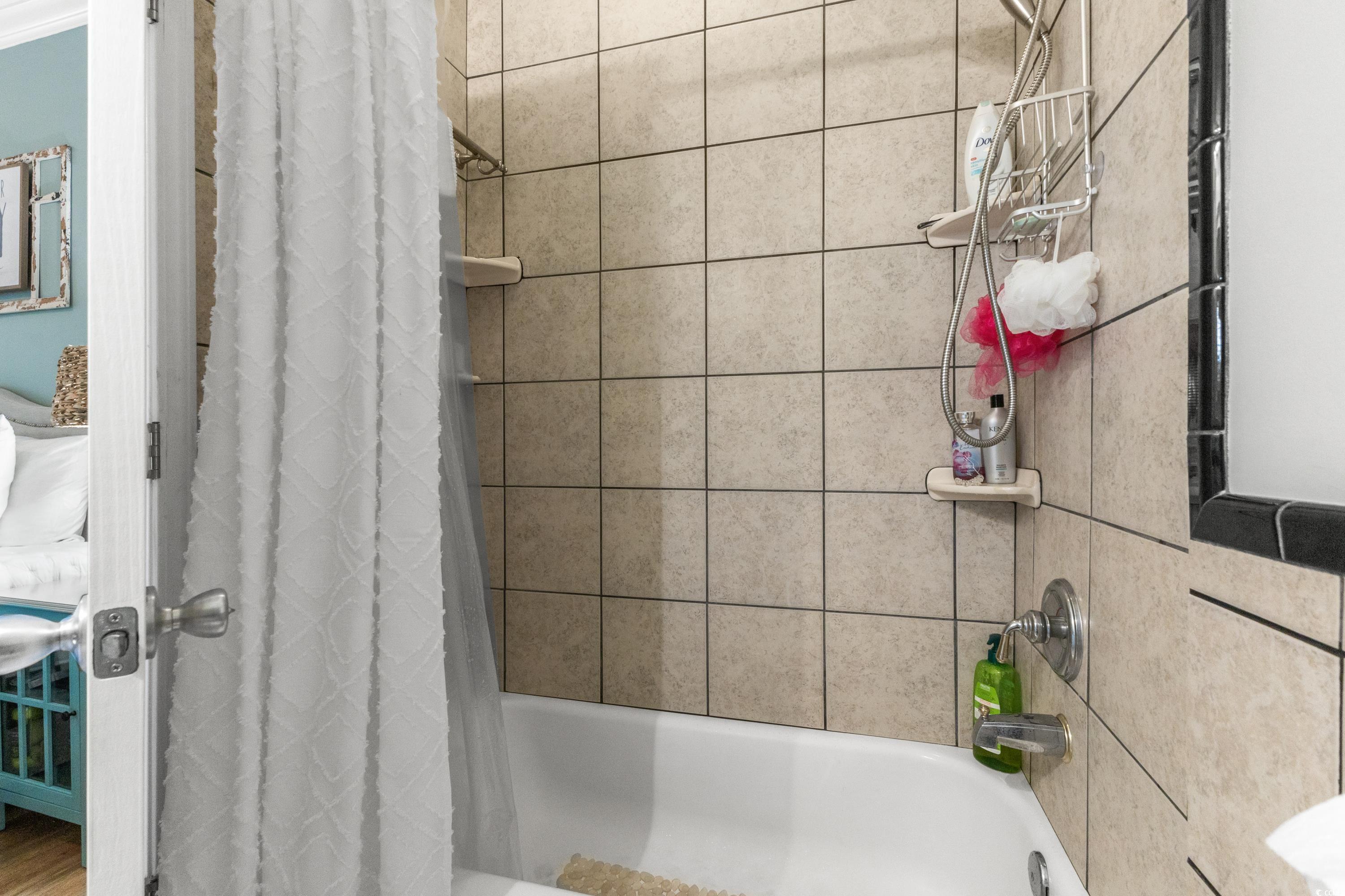 6001-1846a South Kings Highway Myrtle Beach, SC 29575 - Photo 28 of 40 Bathroom featuring shower / bathtub combination with curtain