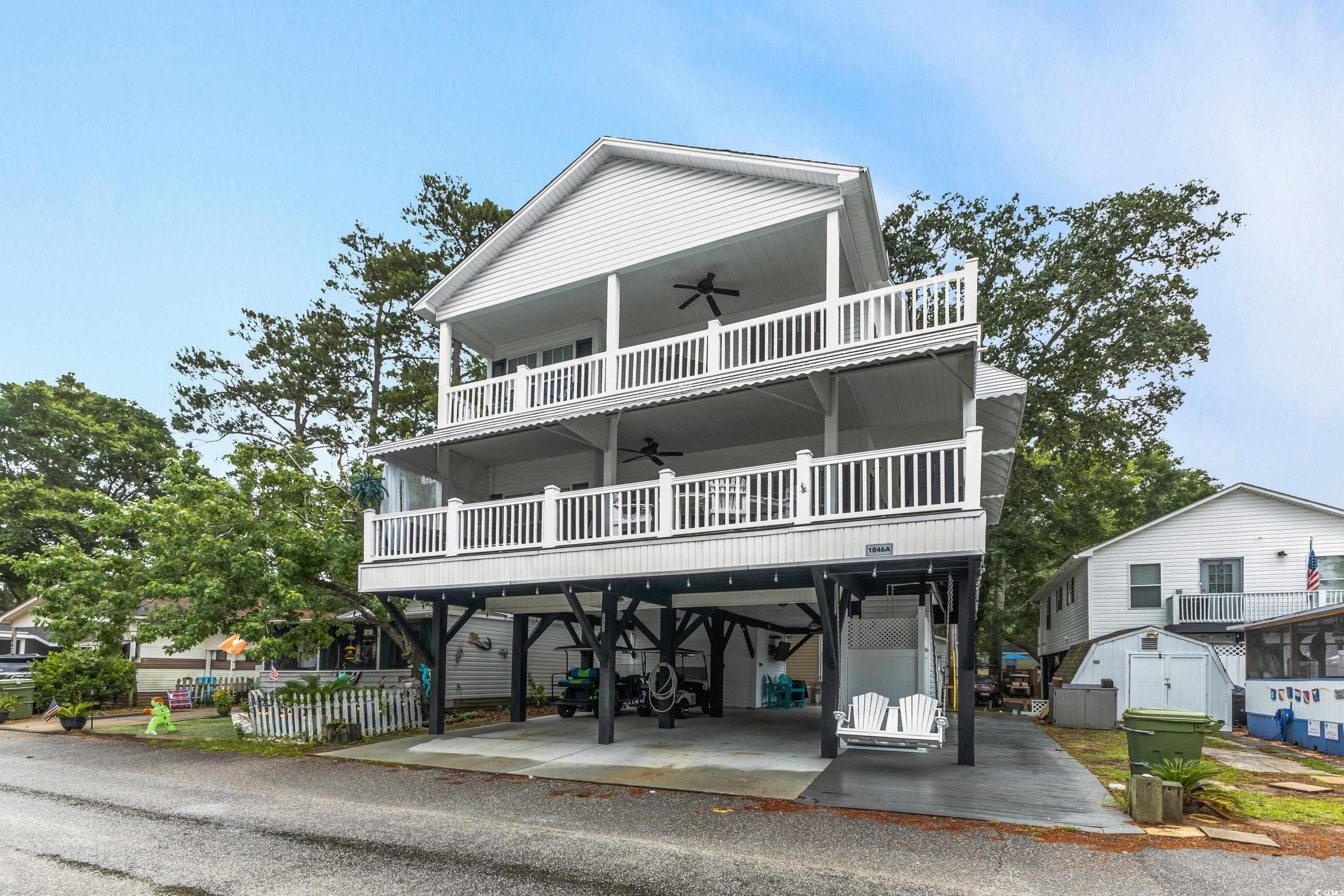 6001-1846a South Kings Highway Myrtle Beach, SC 29575 - Photo 4 of 40 Beach home with a balcony and ceiling fan