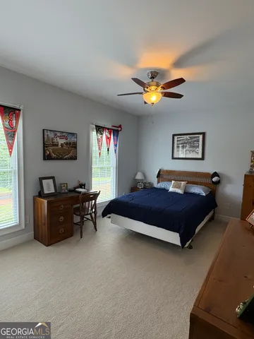 a bed room with furniture and a window