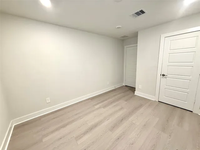 a kitchen with a sink a counter space appliances and cabinets
