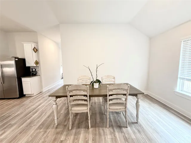 a living room with couches and a flat screen tv