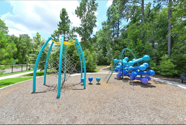 a park with bench and trees