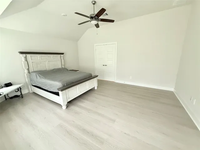 a spacious bathroom with a tub sink and mirror
