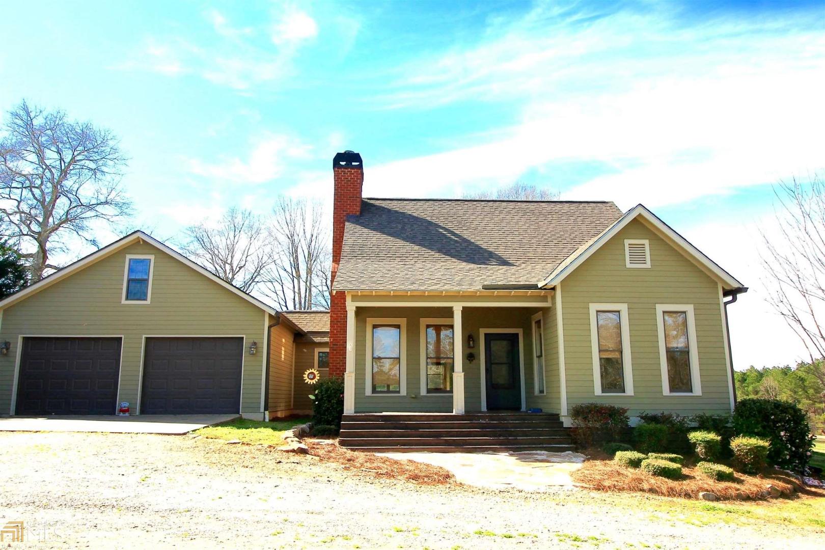 3390 Bostwick Road Madison, GA 30650 - Photo 1 of 1 a front view of a house with a yard