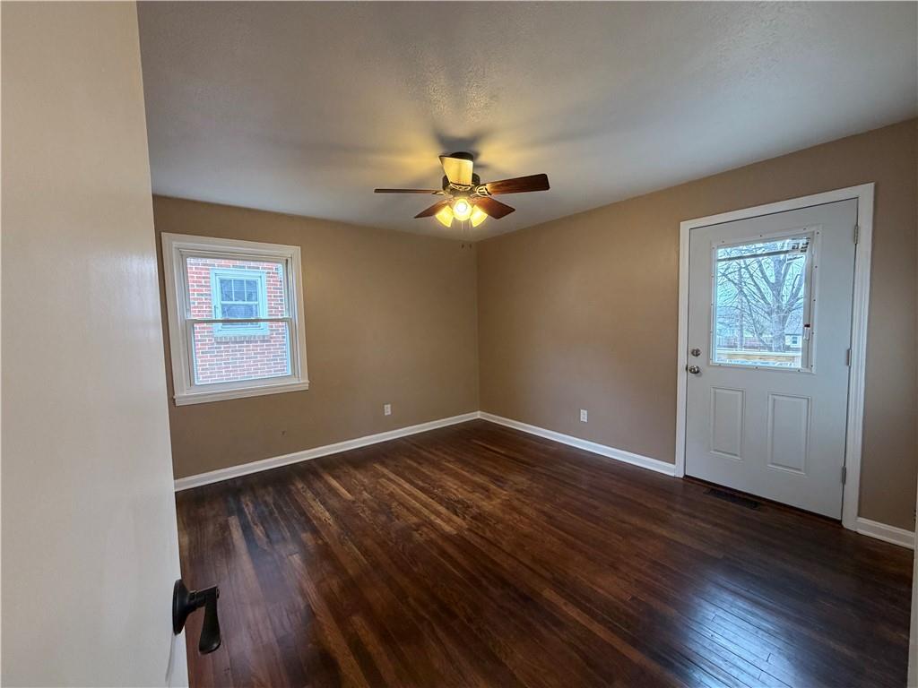 959 Bechtol Avenue Sharon, PA 16146 - Photo 13 of 29 a view of an empty room with wooden floor and a window