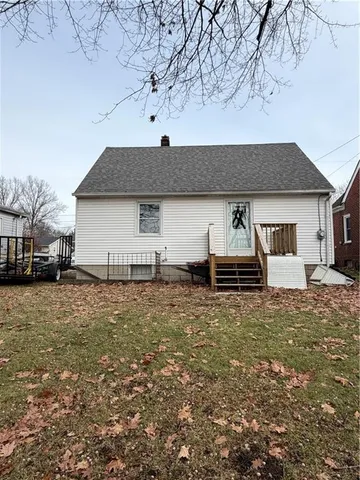 a house view with a backyard space