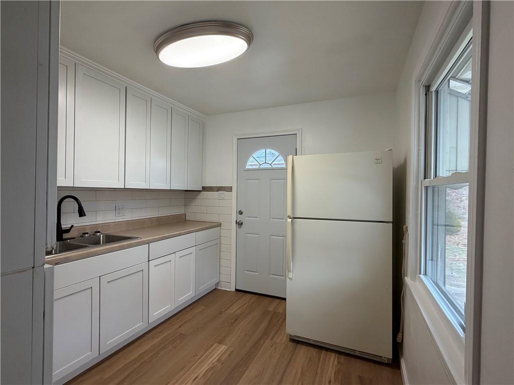 959 Bechtol Avenue Sharon, PA 16146 - Photo 10 of 29 a kitchen with a refrigerator sink and cabinets
