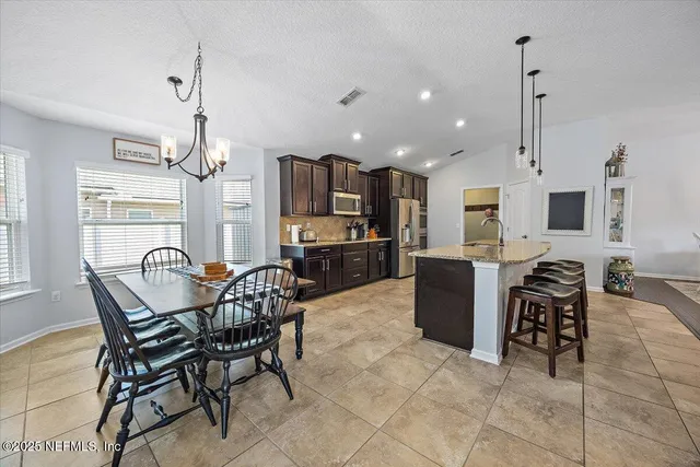a living room with fireplace furniture and a flat screen tv