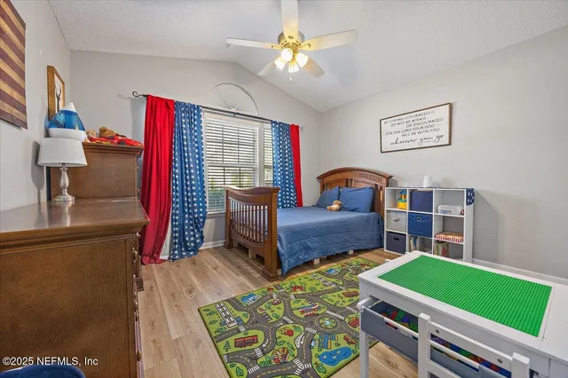 a bedroom with a bed and a bookshelf