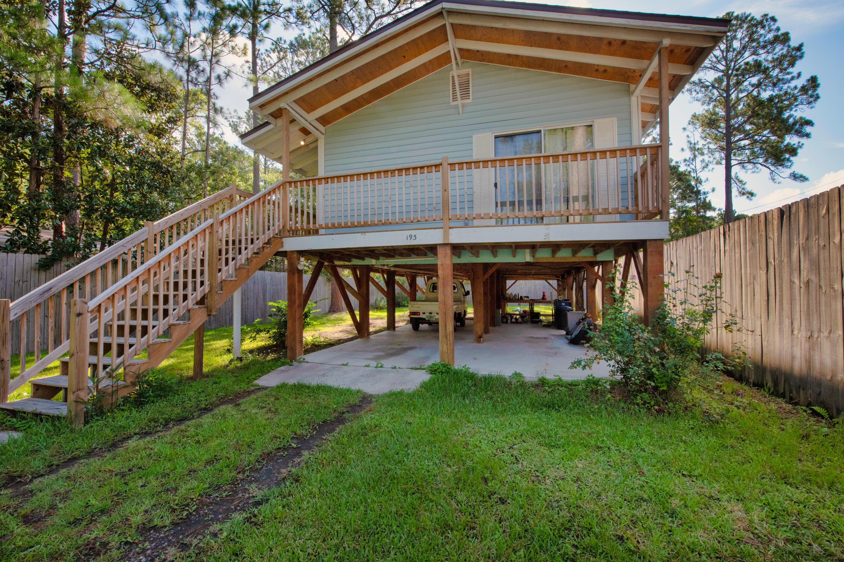 193 L Street Santa Rosa Beach, FL 32459 - Photo 1 of 24 a view of house with backyard and deck
