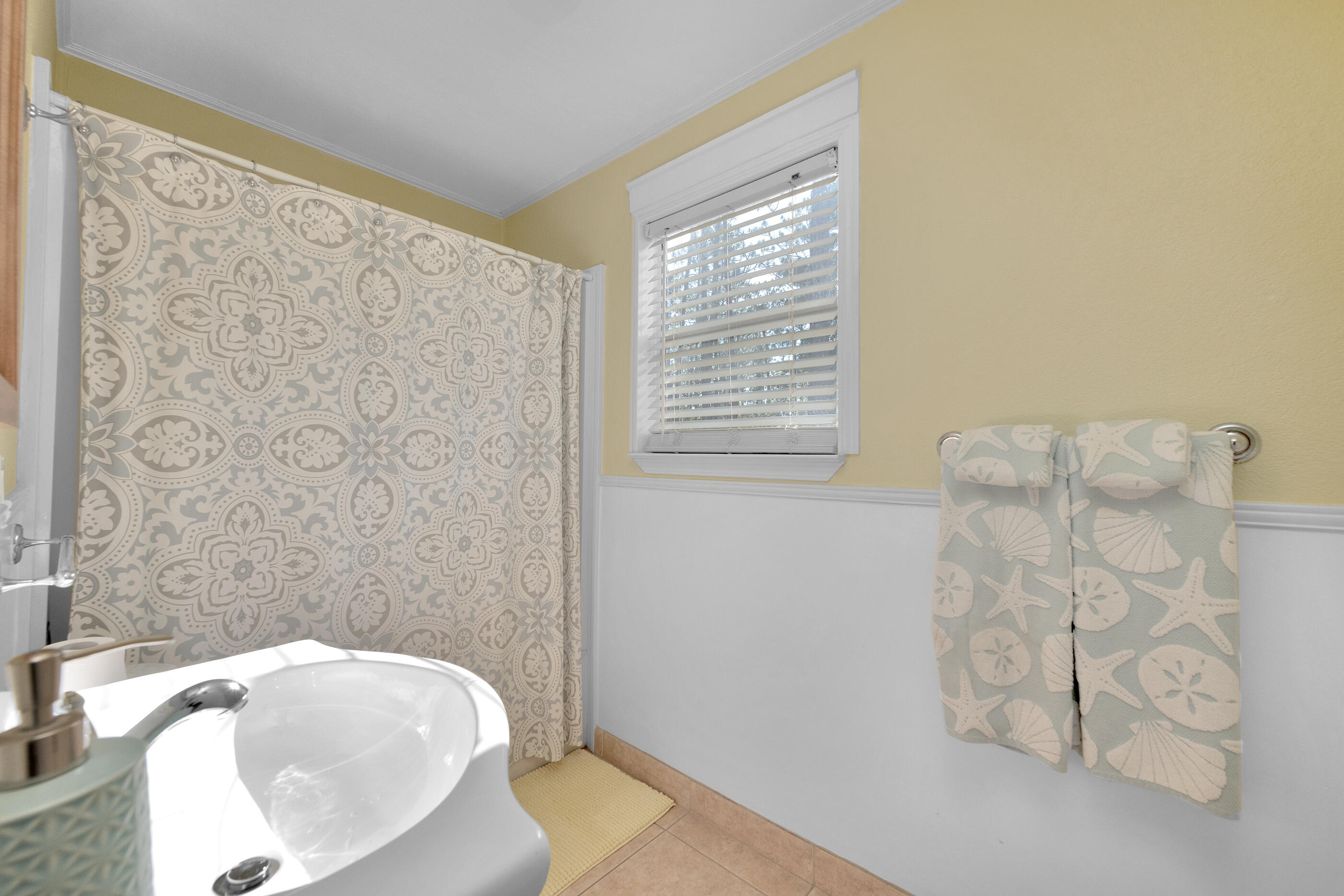 193 L Street Santa Rosa Beach, FL 32459 - Photo 18 of 24 a bathroom with a tub sink and granite
