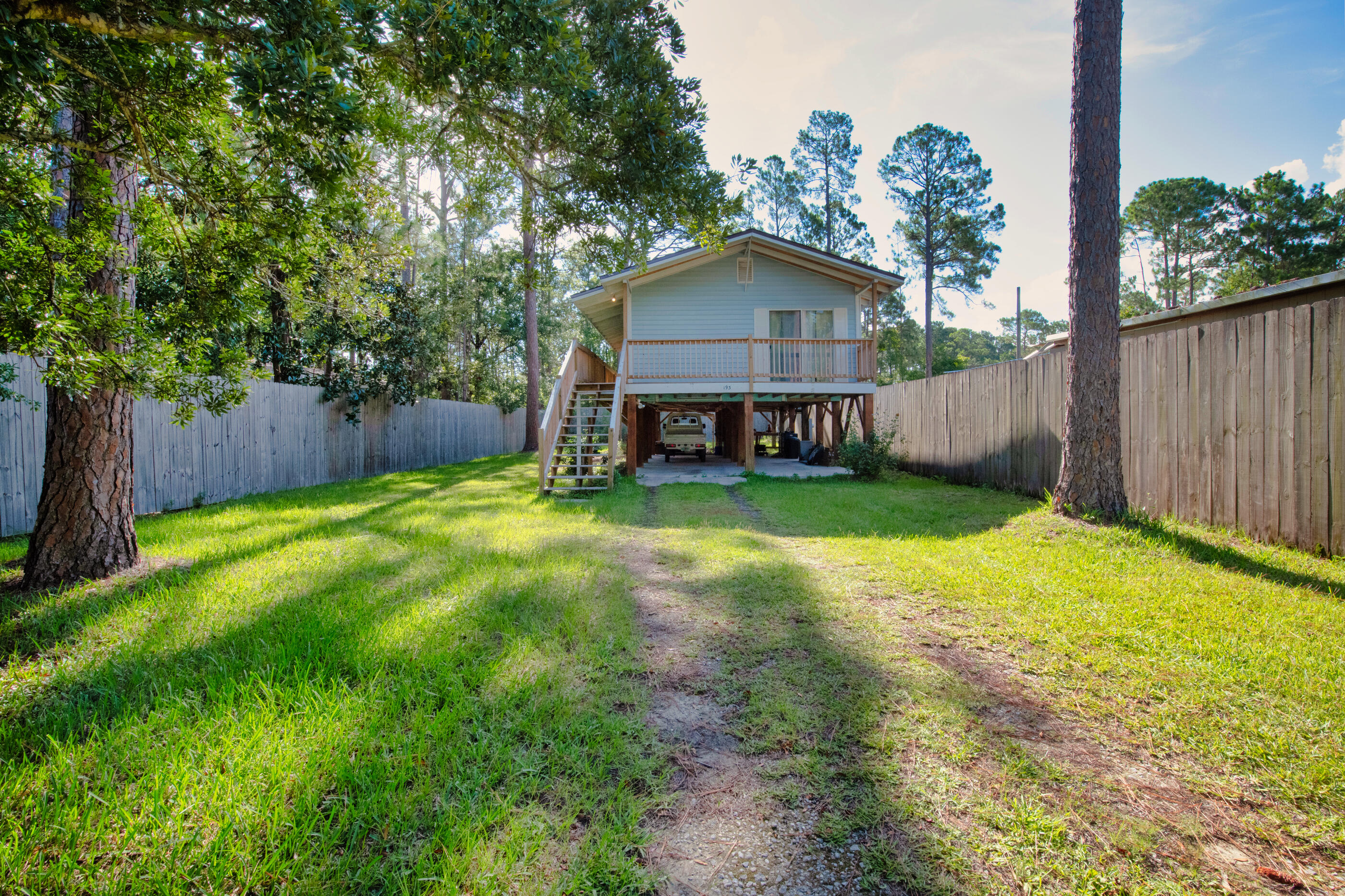 193 L Street Santa Rosa Beach, FL 32459 - Photo 23 of 24 a view of a house with a yard and sitting area