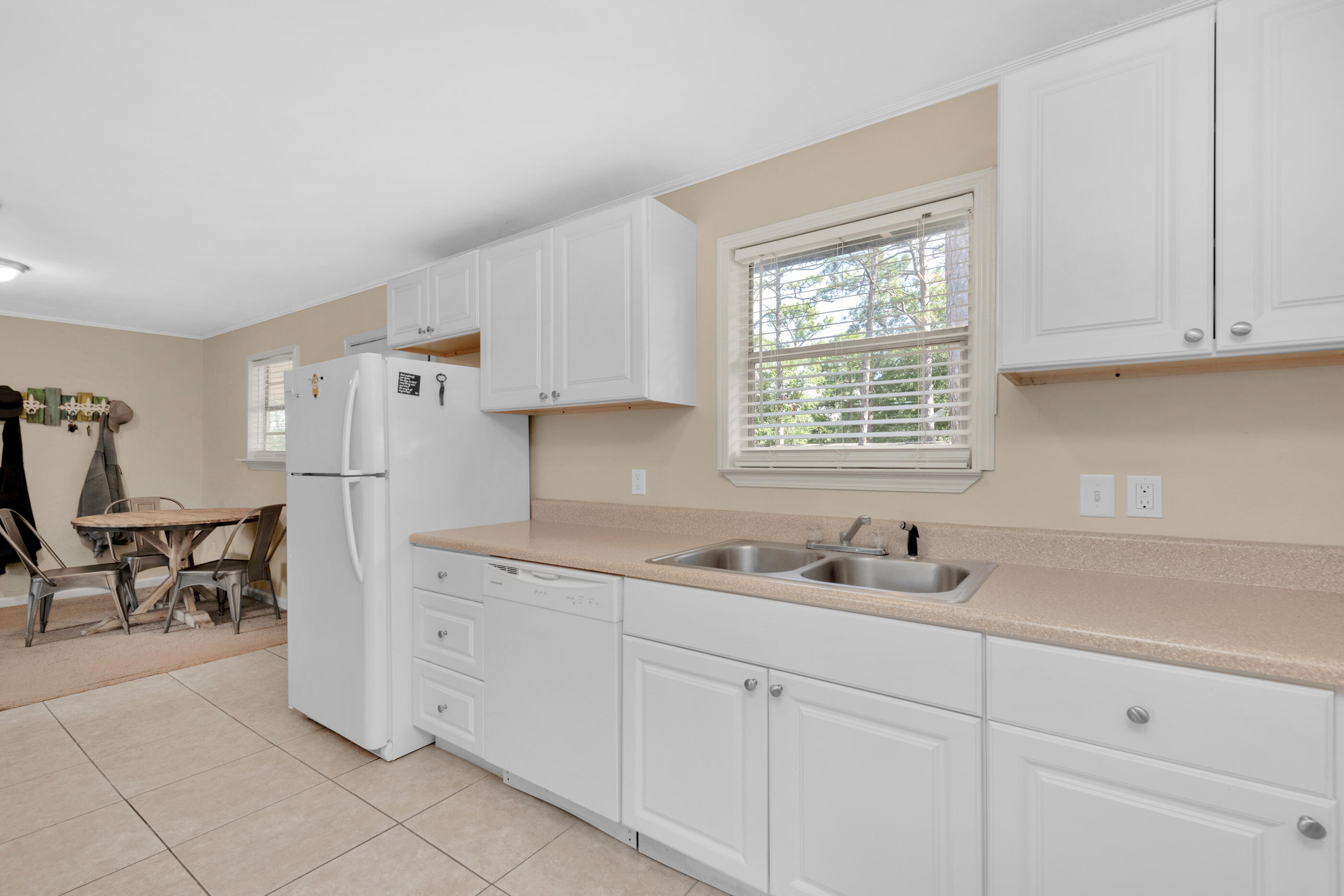 193 L Street Santa Rosa Beach, FL 32459 - Photo 7 of 24 a kitchen with a sink cabinets and window