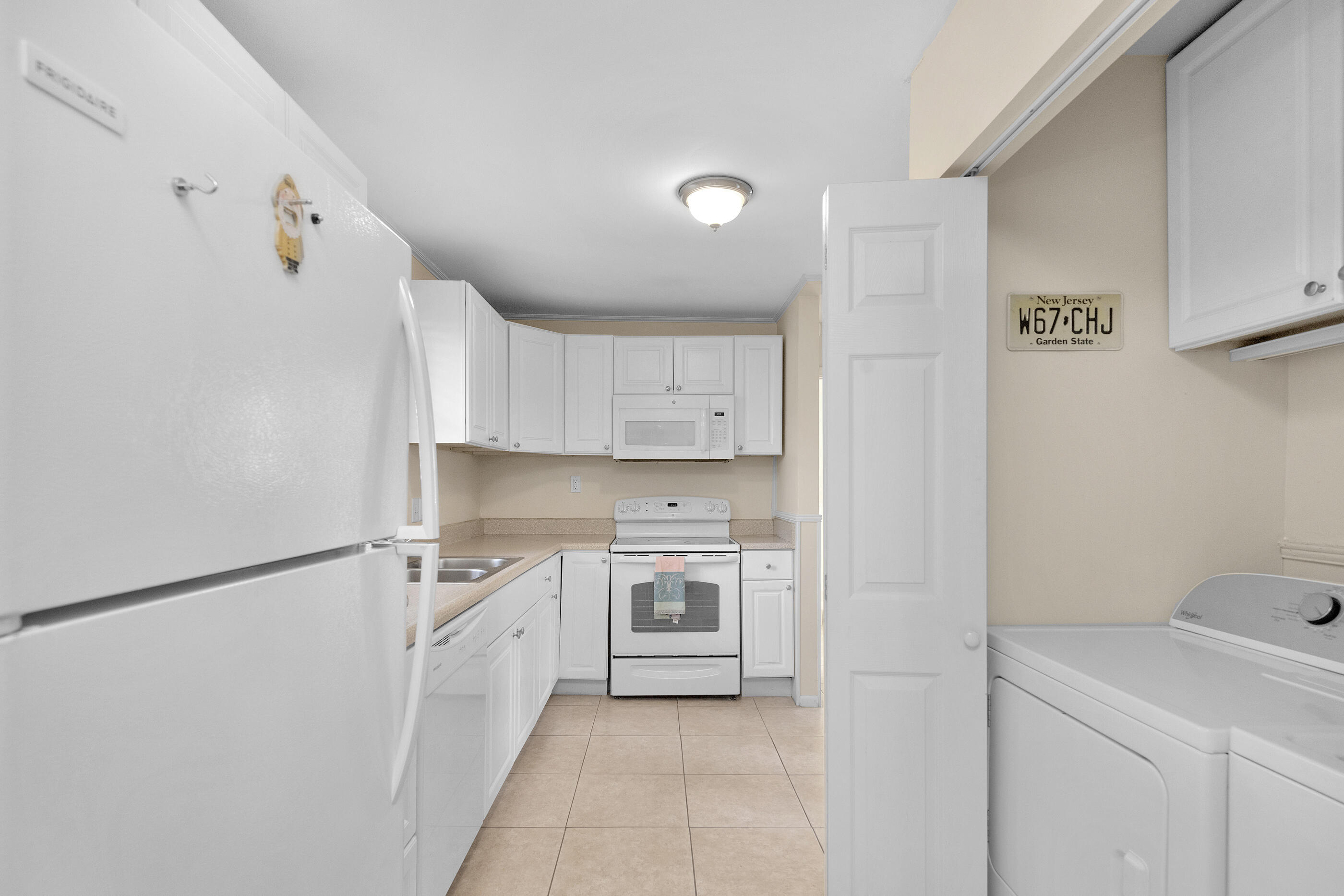 193 L Street Santa Rosa Beach, FL 32459 - Photo 10 of 24 a kitchen with a stove top oven and cabinets