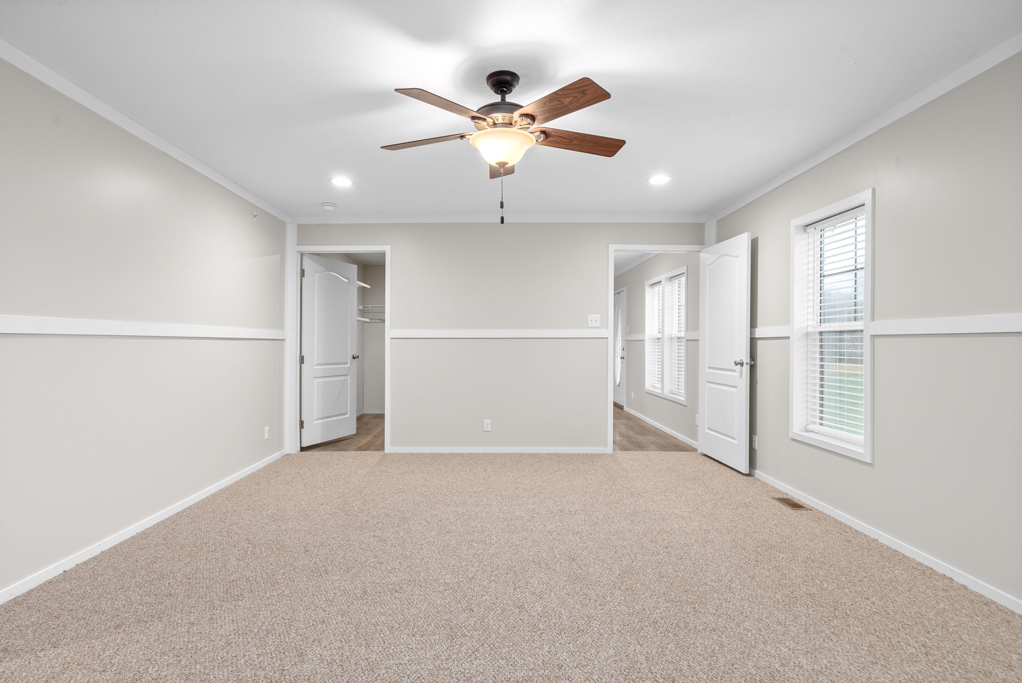 4367 Woodrow Wilson Road Springfield, TN 37172 - Photo 16 of 36 an empty room with chandelier fan and windows