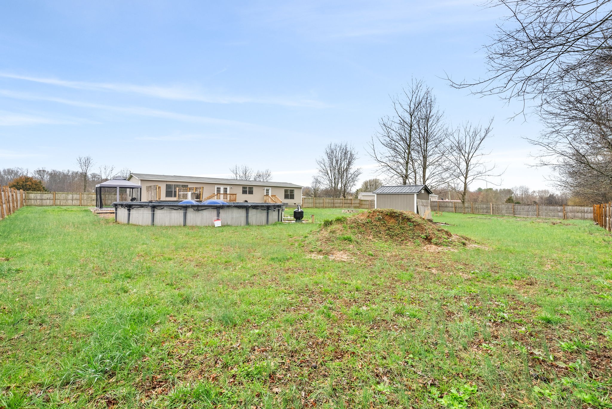 4367 Woodrow Wilson Road Springfield, TN 37172 - Photo 30 of 36 a view of a big yard with a large trees
