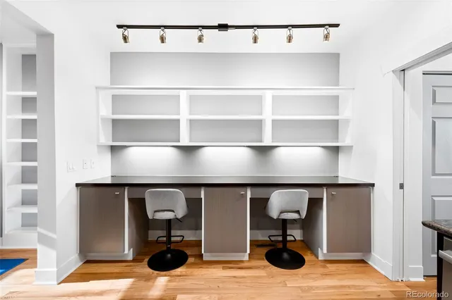 a room with a table and a mirror