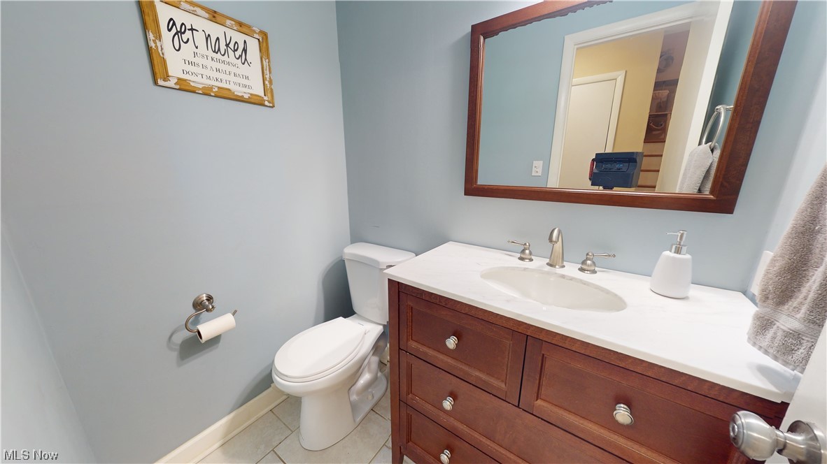 1071 Roland Road Lyndhurst, OH 44124 - Photo 28 of 30 Bathroom with vanity, mirror, and light tile floors