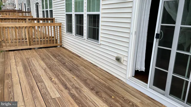 a view of a balcony with wooden floor