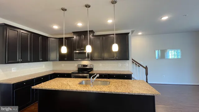 a room with a table chairs and couches