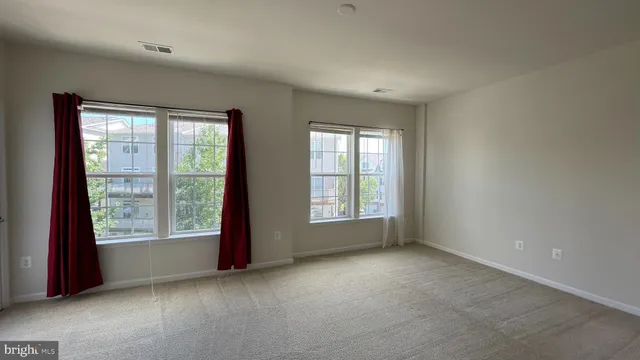 an empty room with windows