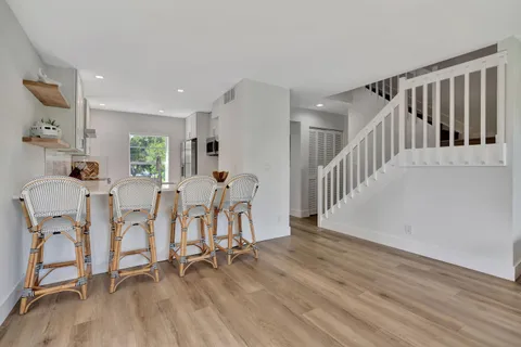 a view of a dining room with furniture window and wooden floor