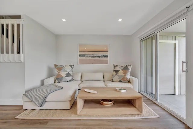 a living room with furniture and a rug
