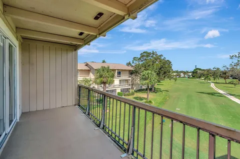 a view of a balcony with lake