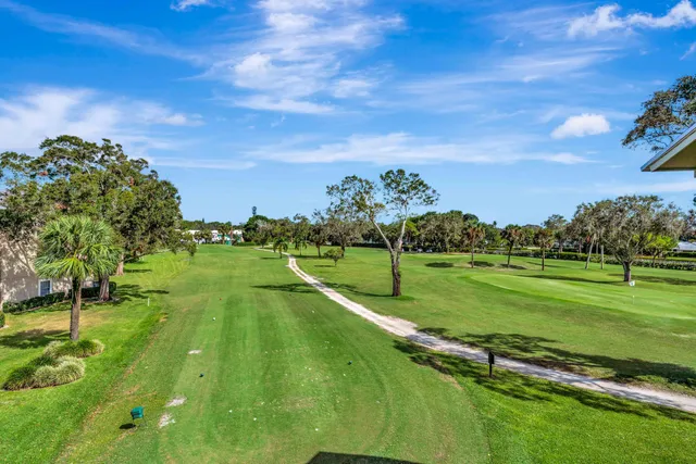 a view of a golf course with a lake view