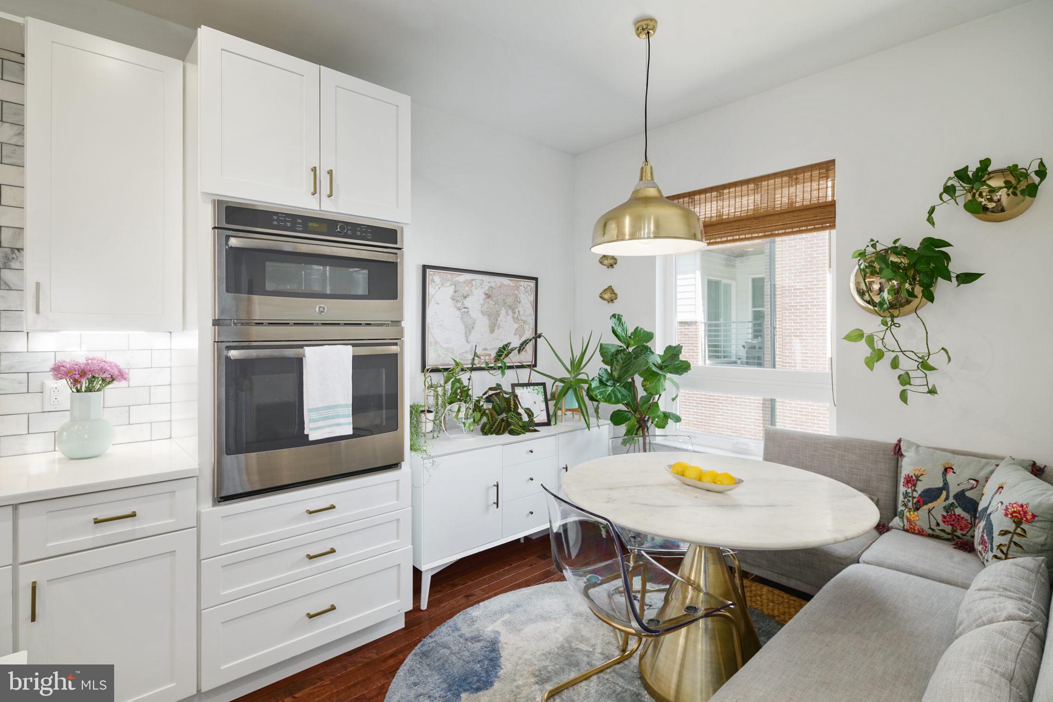 159 East Allen Street, Unit 1 Philadelphia, PA 19125 - Photo 23 of 45 a kitchen with a table and chairs in it