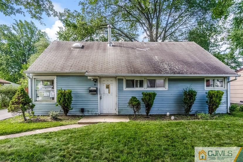 6 Mercury Road Edison, NJ 08817 - Photo 1 of 16 a front view of a house with a garden