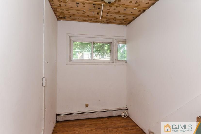 6 Mercury Road Edison, NJ 08817 - Photo 4 of 16 a view of room with hardwood floor and window