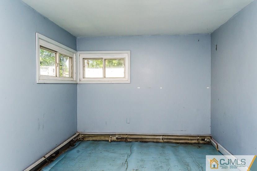6 Mercury Road Edison, NJ 08817 - Photo 5 of 16 an empty room with a window