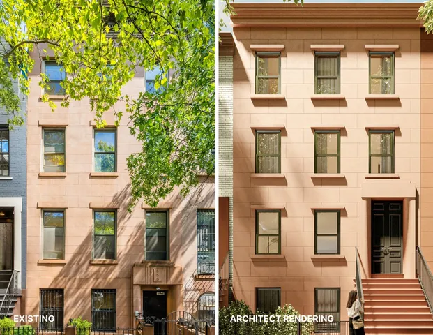 a view of a brick building next to a large building