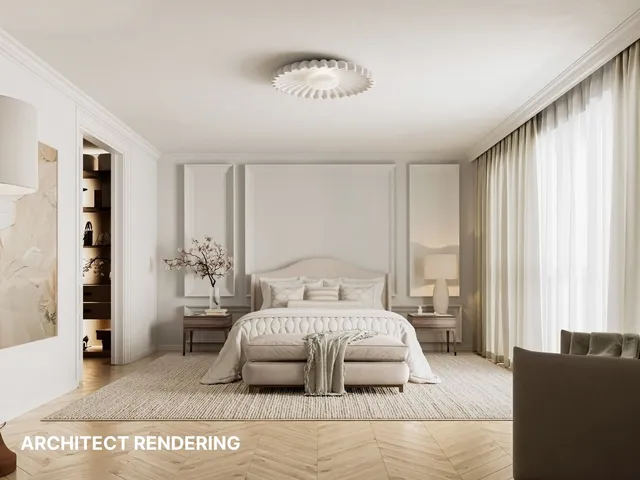 a bedroom with a large bed and a chandelier