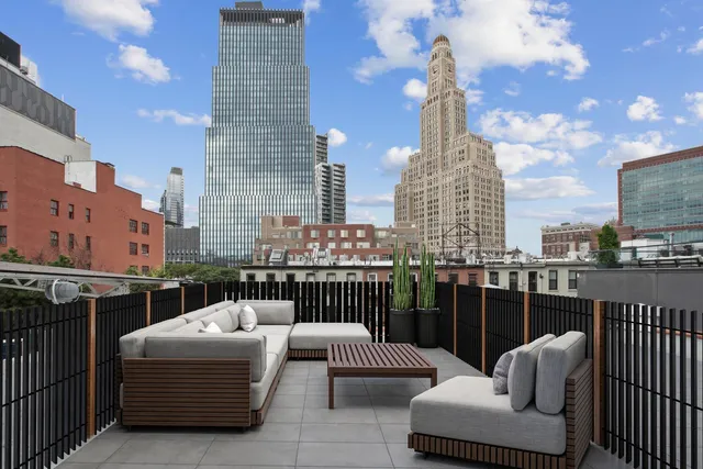 a view of roof deck with patio