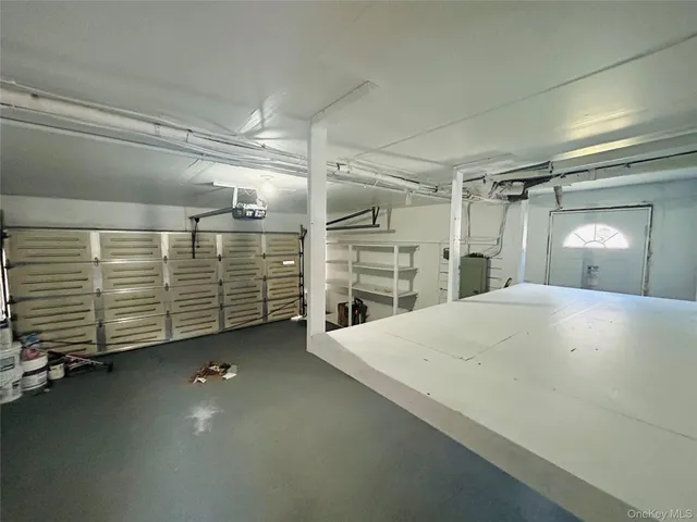 a view of an empty room with a fireplace