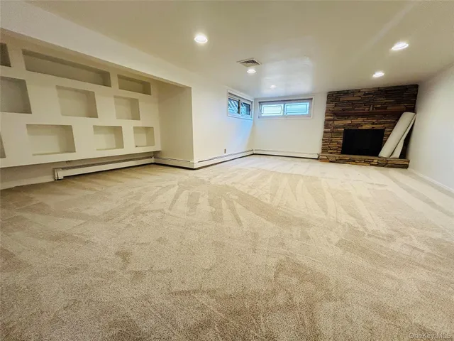 a view of stairs and hall with wooden floor